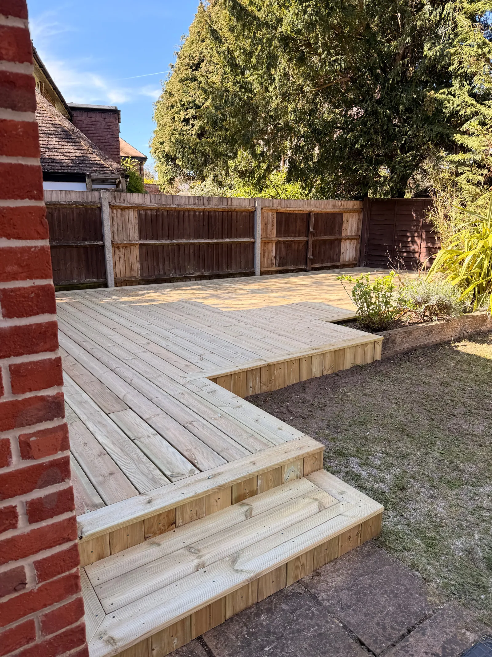 Natural timber decking with a hardwood finish in a private garden